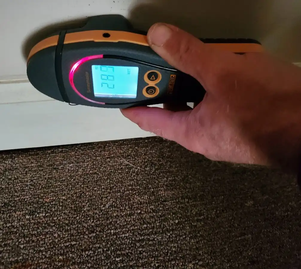 Moisture detection at baseboard during Storm Damage Restoration in Hayward